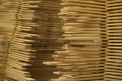 Photo of Stacks of many wooden planks, closeup view