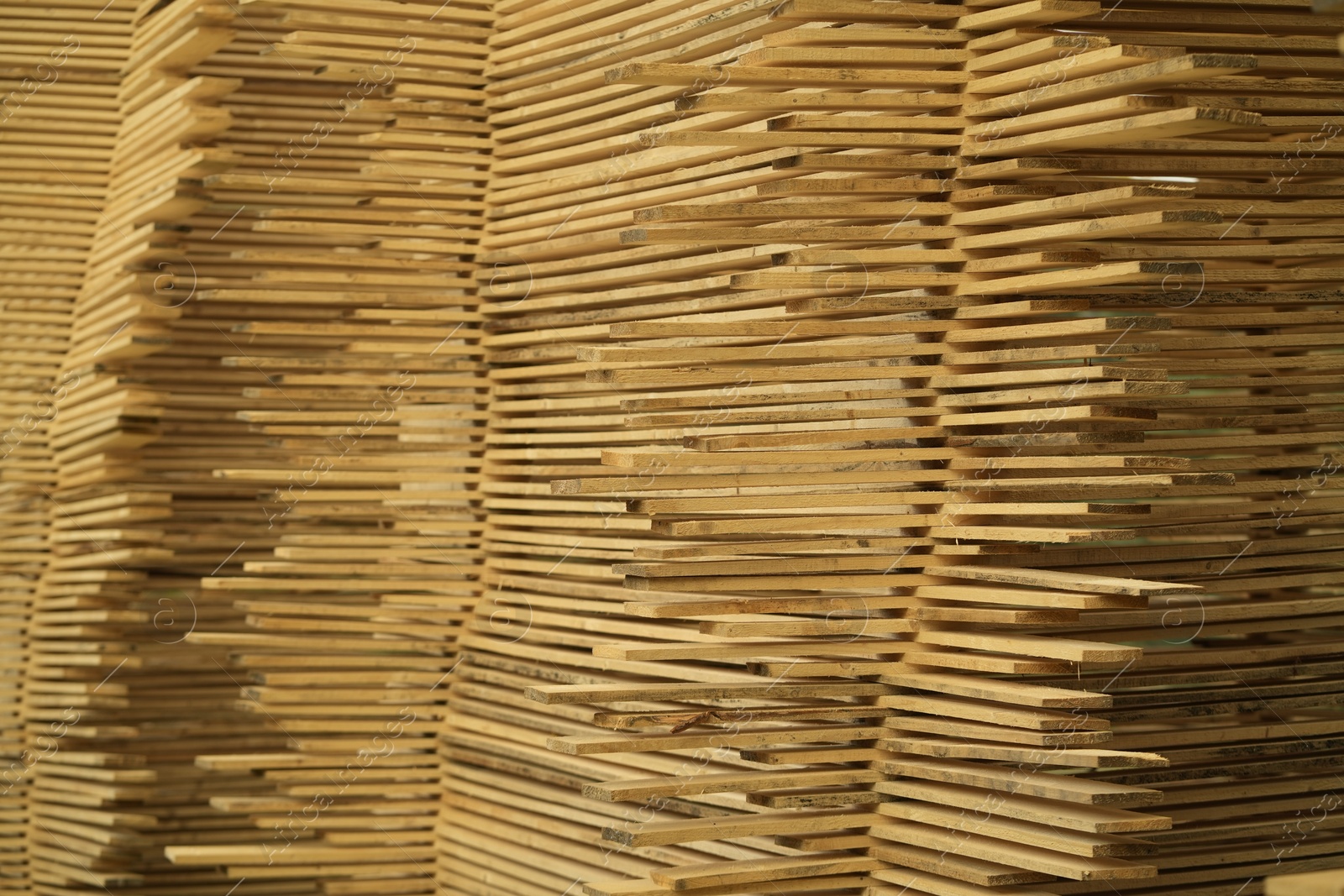 Photo of Stacks of many wooden planks, closeup view