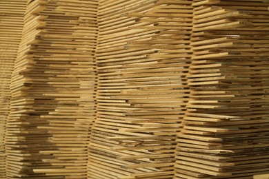 Photo of Stacks of many wooden planks, closeup view