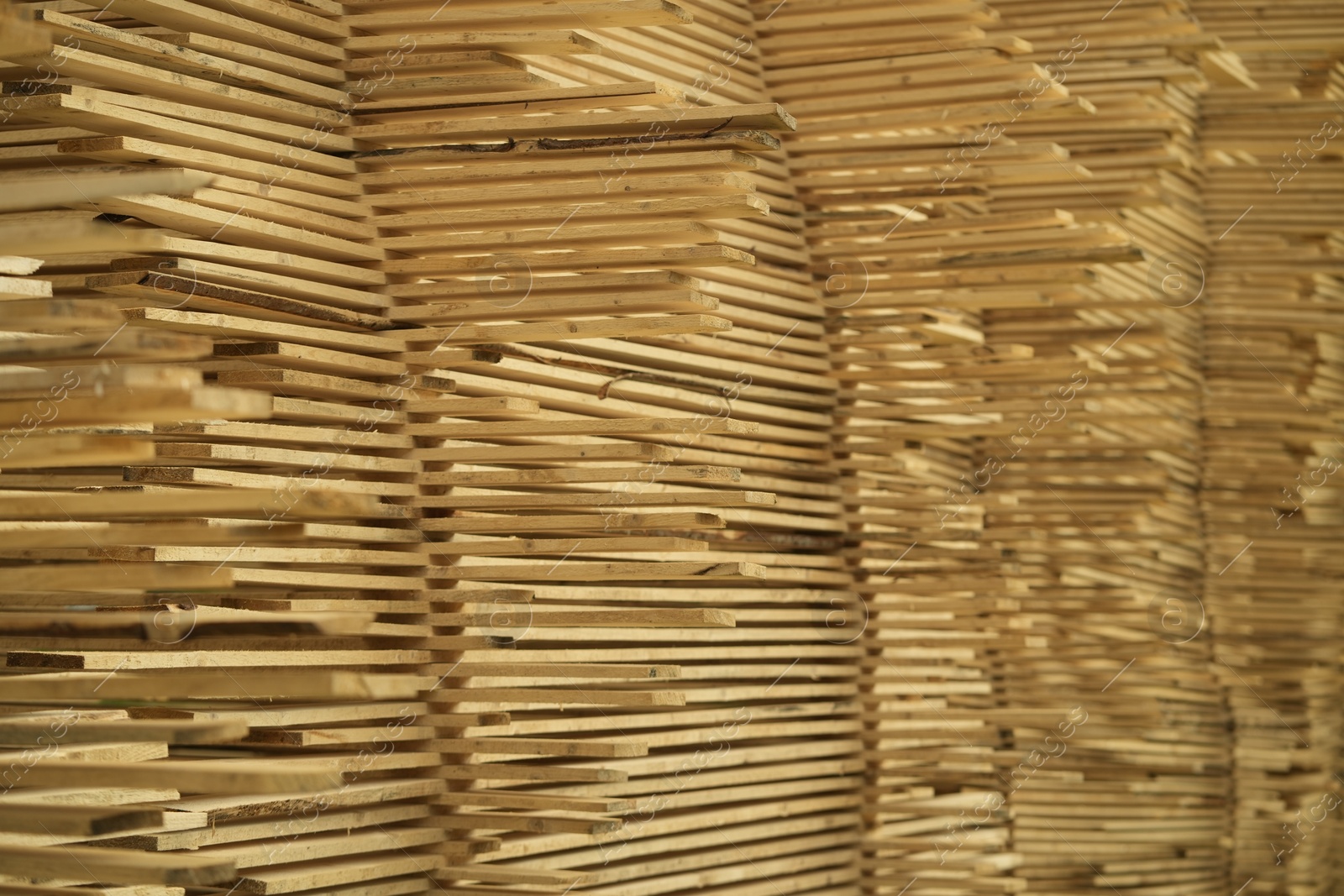 Photo of Stacks of many wooden planks, closeup view