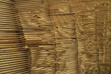 Photo of Stacks of many wooden planks, closeup view