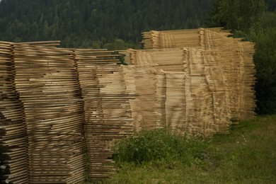 Stacks of many wooden planks in mountains