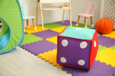 Photo of Stylish child room interior with furniture and different toys