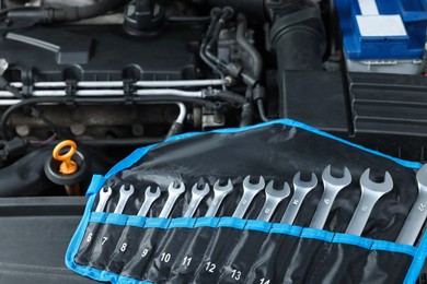 Photo of Set of different auto mechanic's tools at automobile repair shop, closeup