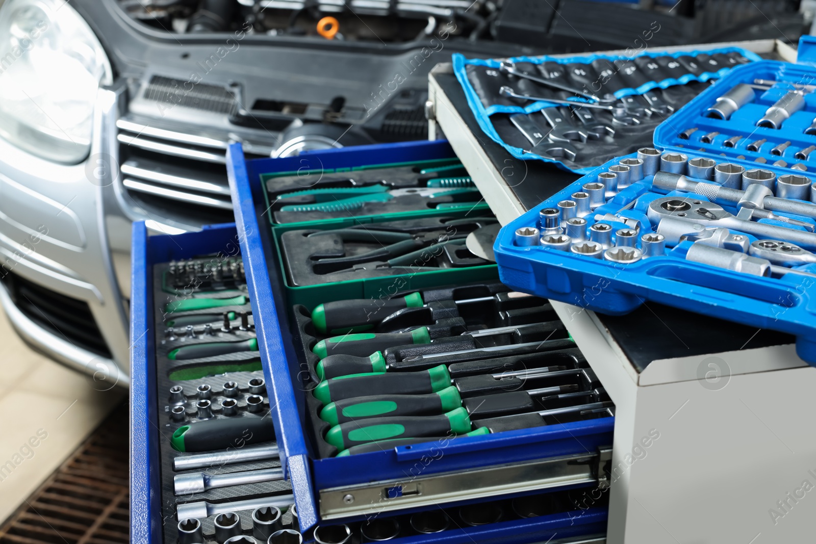 Photo of Set of different auto mechanic's tools at automobile repair shop