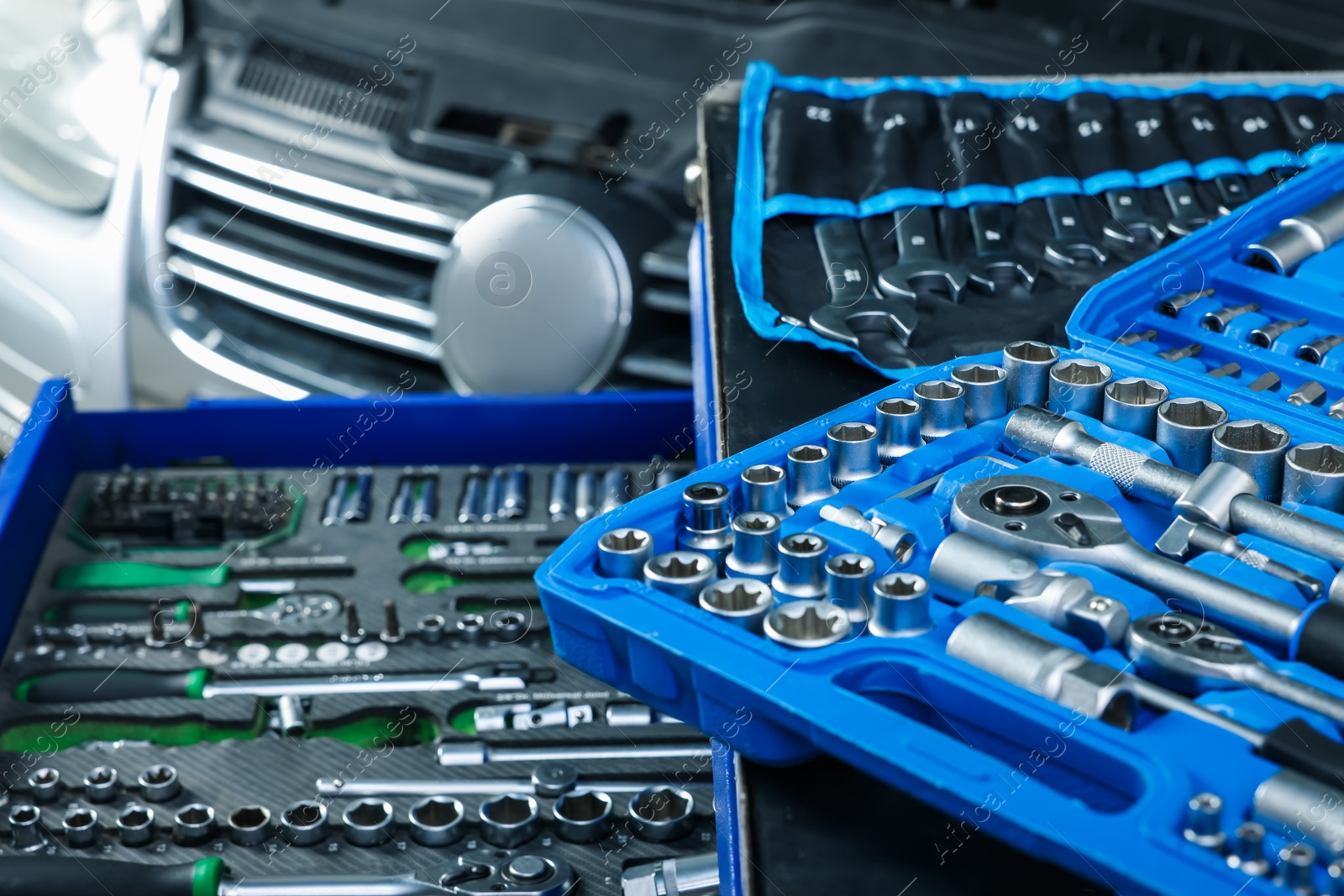 Photo of Set of different auto mechanic's tools at automobile repair shop, closeup