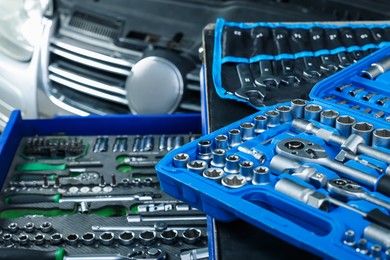 Photo of Set of different auto mechanic's tools at automobile repair shop, closeup