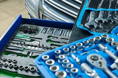 Photo of Set of different auto mechanic's tools at automobile repair shop, closeup