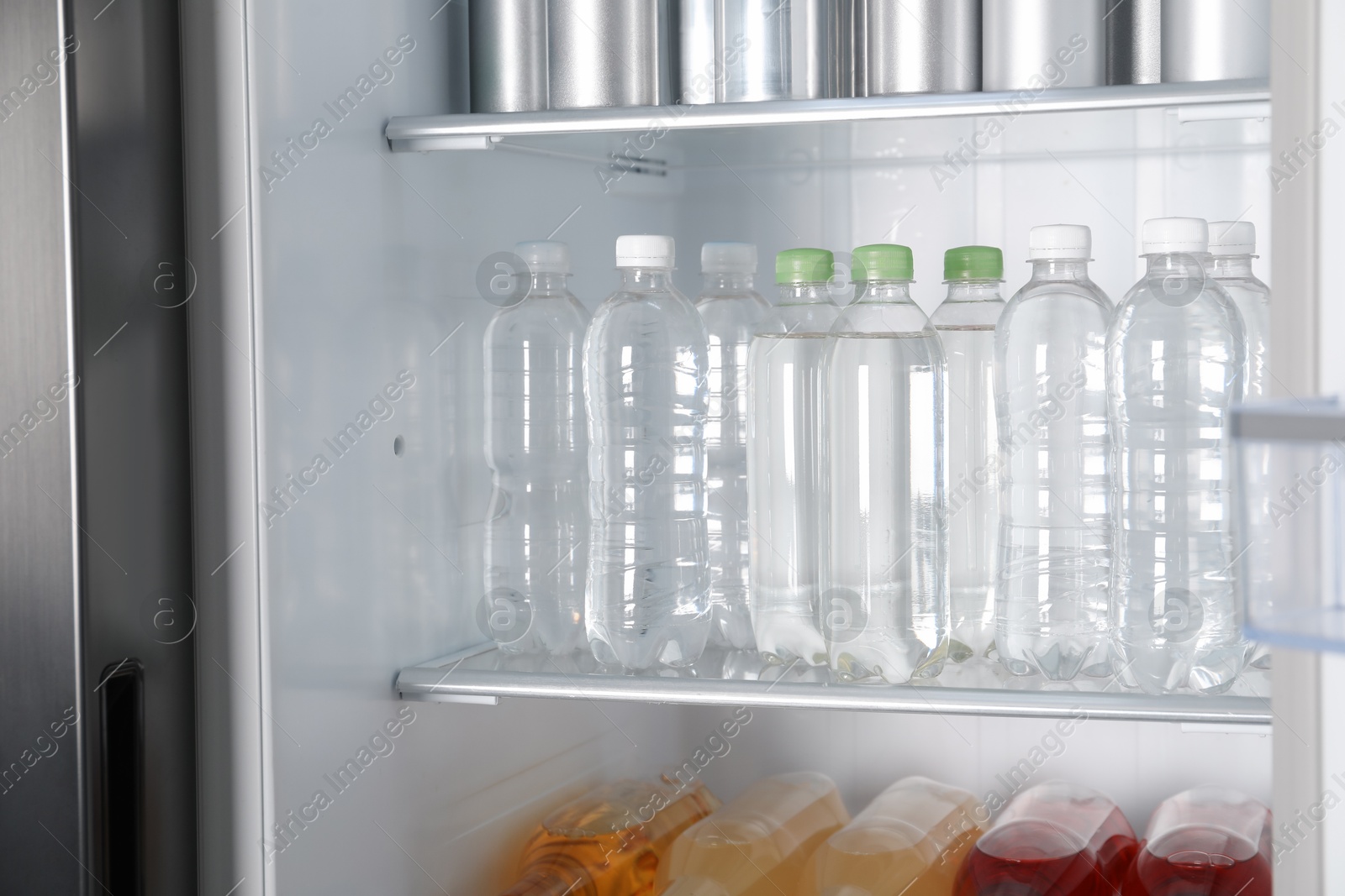 Photo of Many different cold drinks in refrigerator, closeup