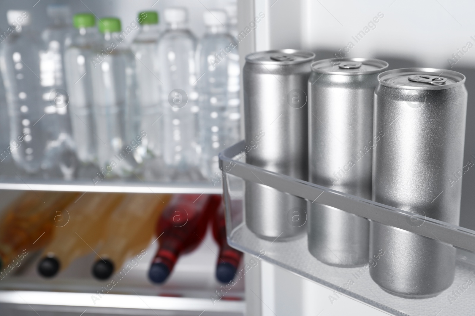 Photo of Many different cold drinks in refrigerator, closeup