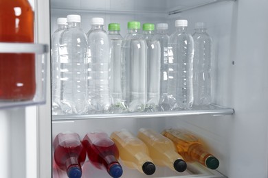 Photo of Many different cold drinks in refrigerator, closeup