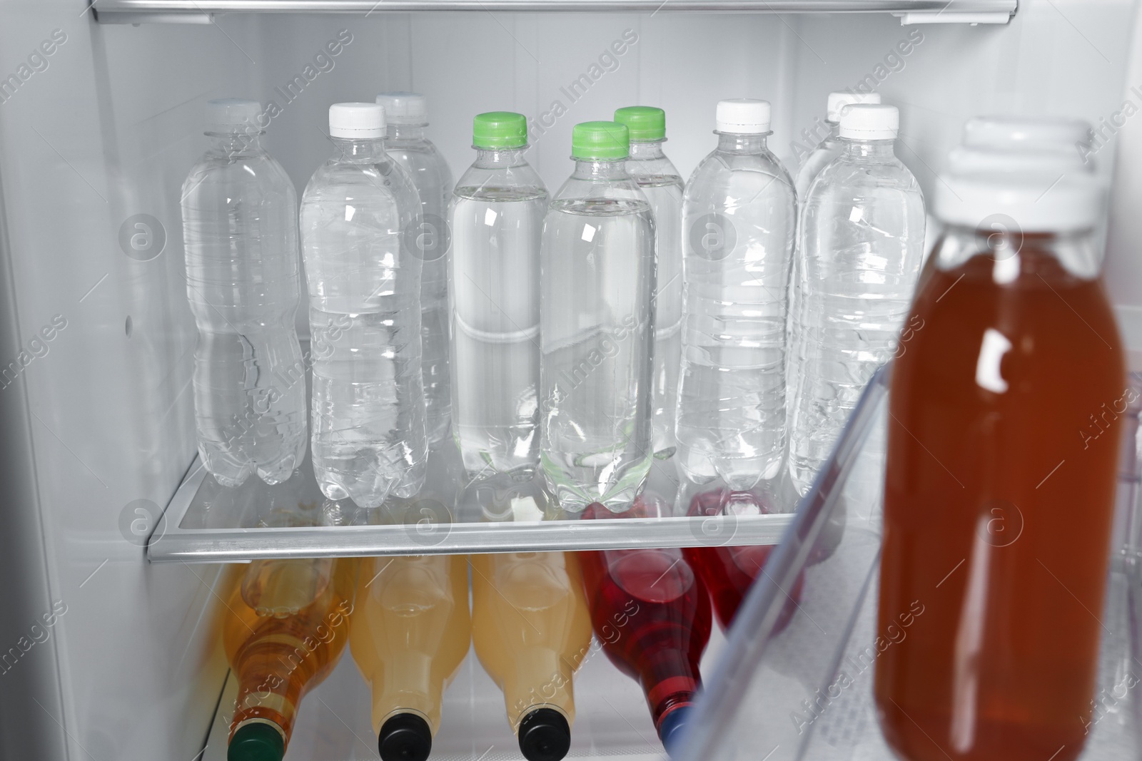 Photo of Many different cold drinks in refrigerator, closeup