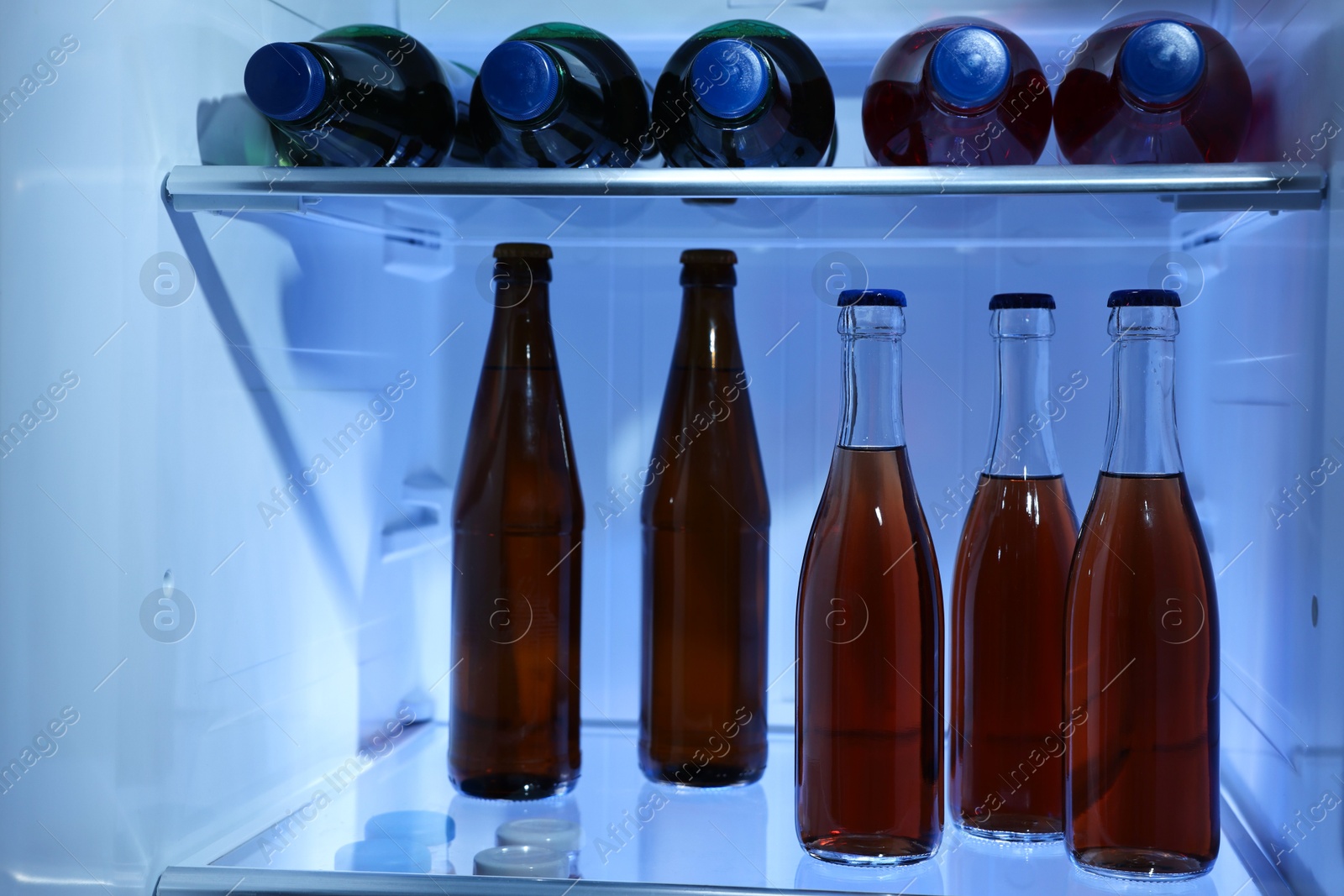 Photo of Many different cold drinks in refrigerator, closeup