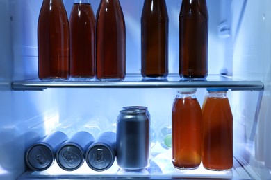 Photo of Many different cold drinks in refrigerator, closeup