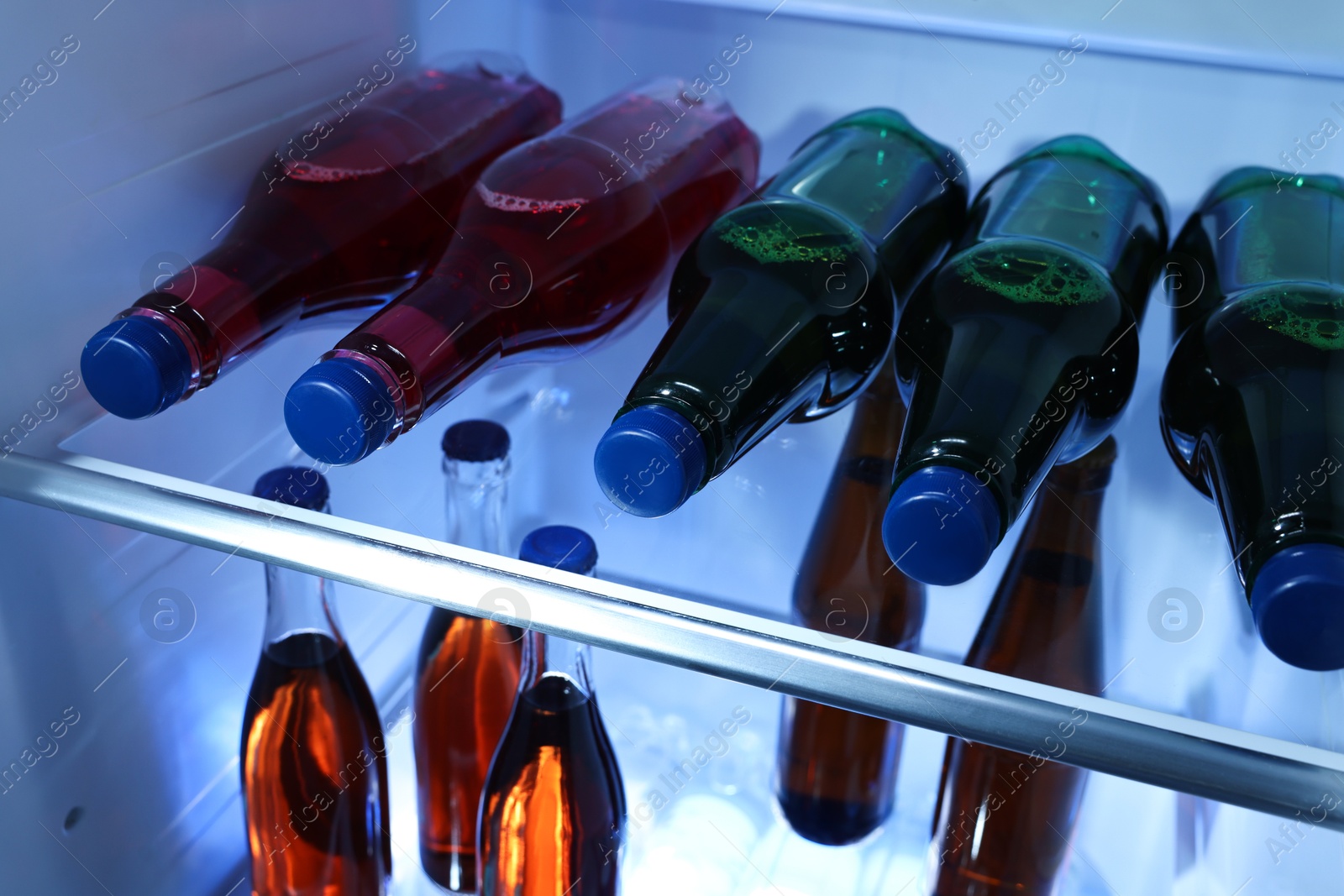 Photo of Many different cold drinks in refrigerator, closeup