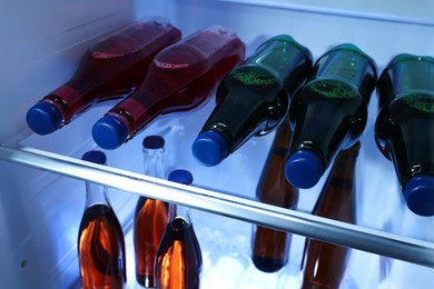 Many different cold drinks in refrigerator, closeup