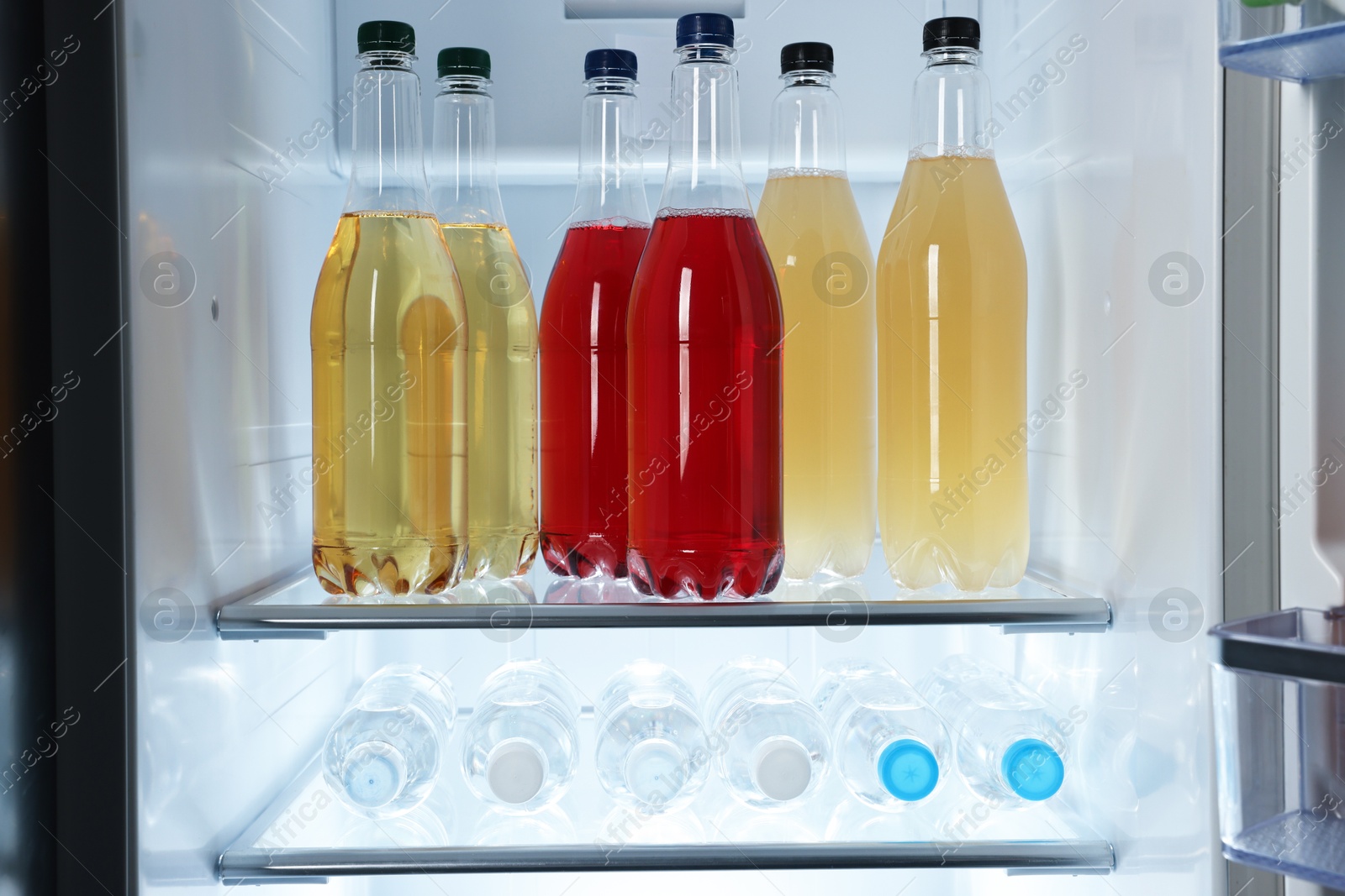 Photo of Many different cold drinks in refrigerator, closeup