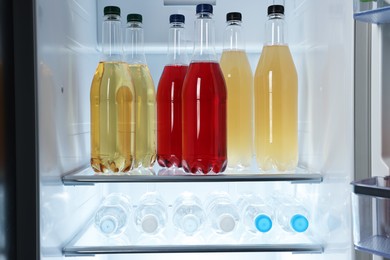 Many different cold drinks in refrigerator, closeup