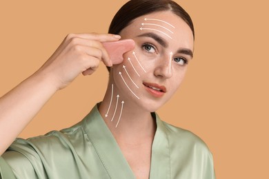 Beautiful young woman doing facial massage with gua sha tool on dark beige background. Lines on skin showing directions of motion