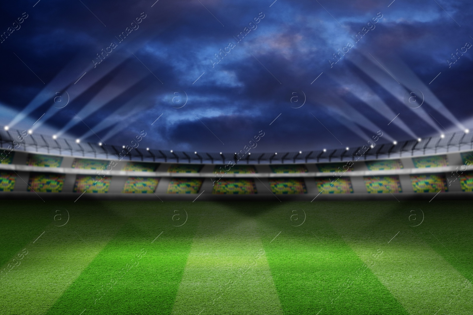 Image of Football stadium with seats, illumination and green grass