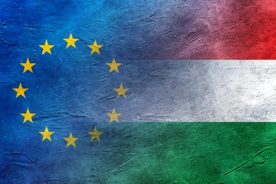 Flags of European Union and Hungary on stone surface, double exposure