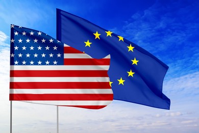 Flags of USA and European Union against sky. Diplomatic international relations