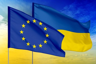 Image of Flags of European Union and Ukraine against sky. Diplomatic international relations