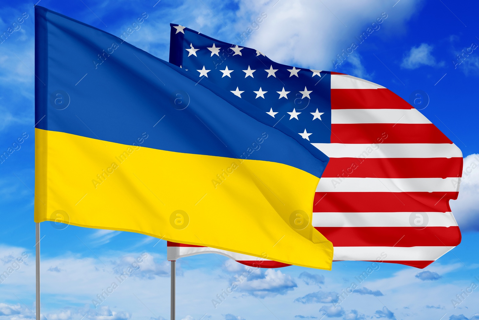 Image of Flags of Ukraine and USA against sky. Diplomatic international relations