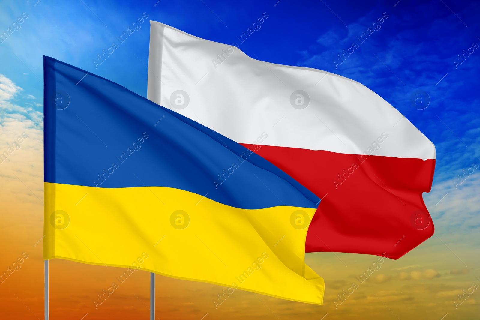 Image of Flags of Ukraine and Poland against sky. Diplomatic international relations