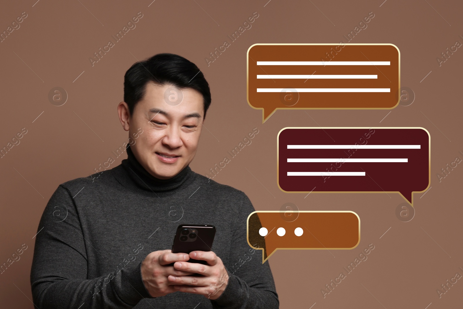 Image of Happy man sending message via smartphone on brown background. Speech bubbles near him