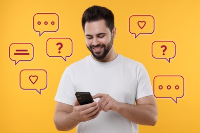 Image of Happy man sending message via smartphone on orange background. Speech bubbles near him