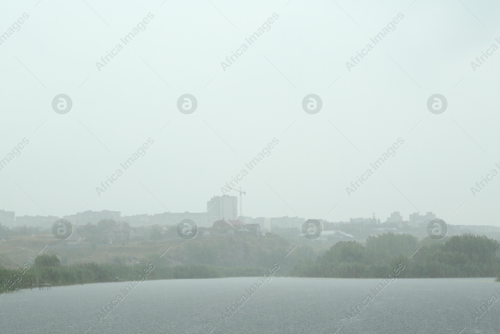 Photo of Picturesque view of lake on rainy day outdoors