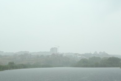 Photo of Picturesque view of lake on rainy day outdoors