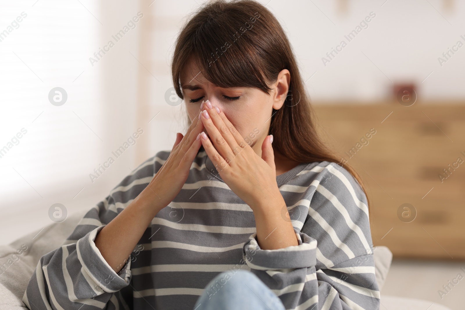 Photo of Tired woman suffering from sinusitis at home