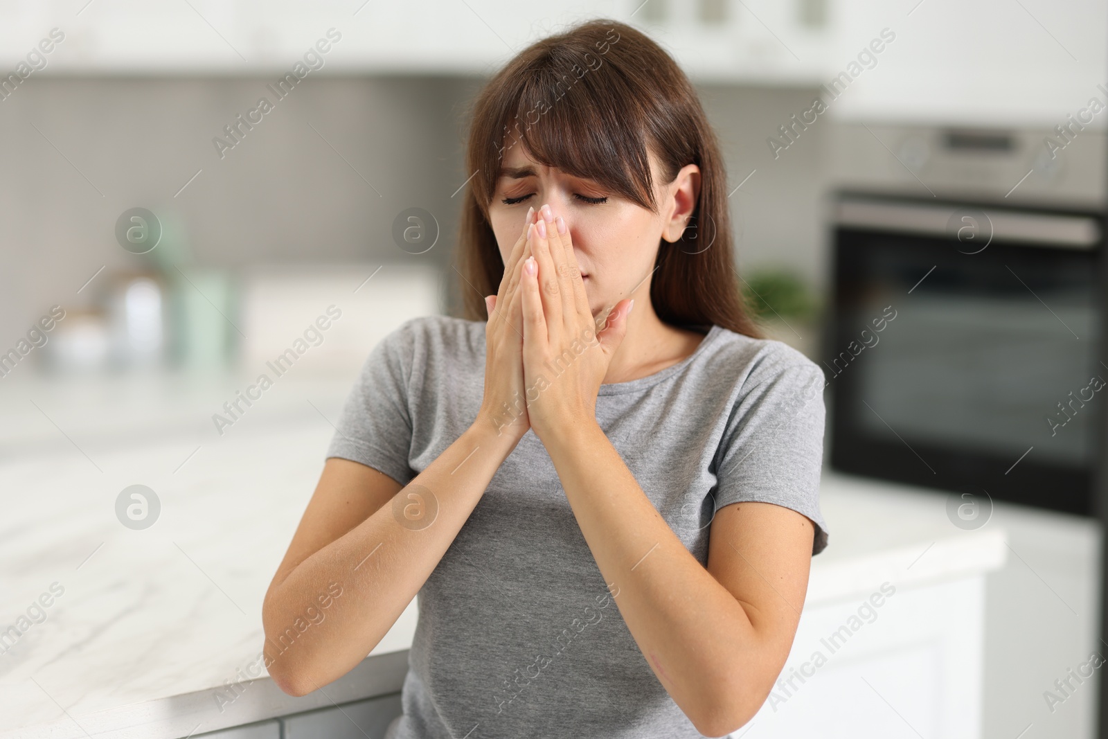 Photo of Tired woman suffering from sinusitis at home