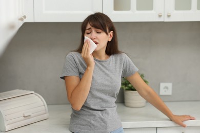 Photo of Tired woman suffering from sinusitis at home