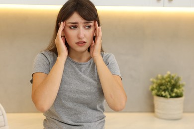 Photo of Tired woman suffering from sinusitis at home