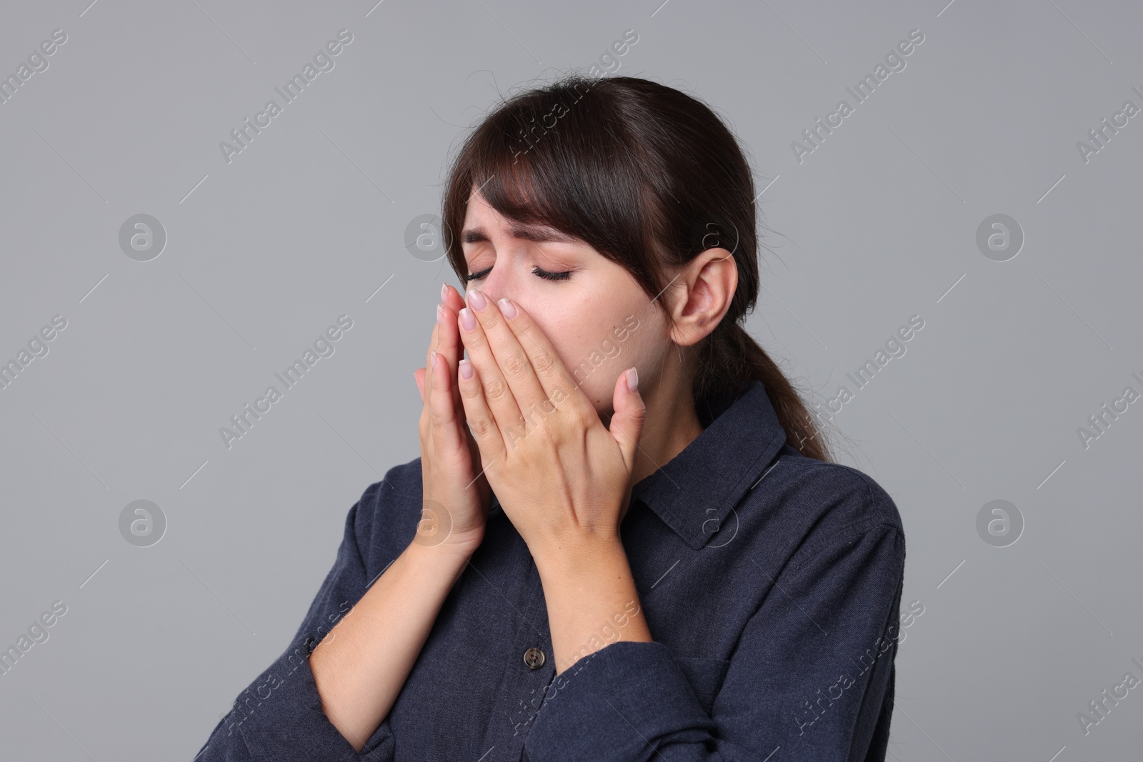 Photo of Woman suffering from sinusitis on grey background