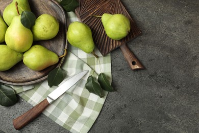 Photo of Many fresh ripe pears and knife on grey table, top view. Space for text