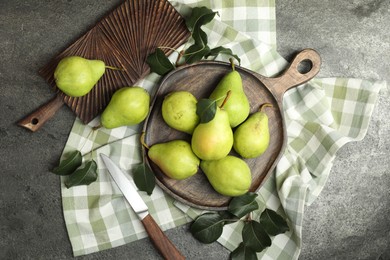 Photo of Many fresh ripe pears and knife on grey table, top view