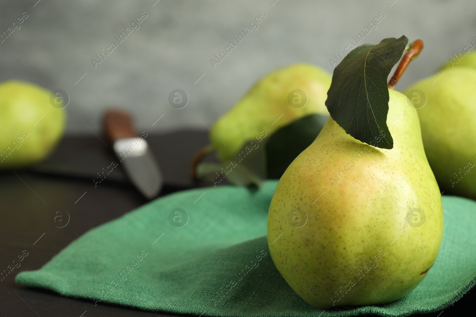 Photo of Fresh ripe pears on black table, closeup