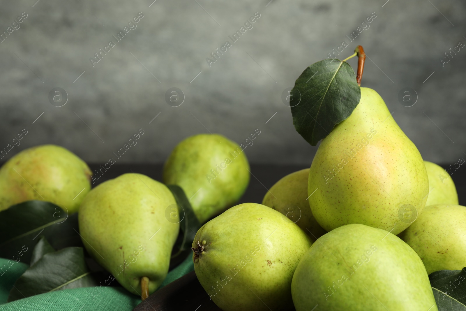 Photo of Many fresh ripe pears on table, closeup