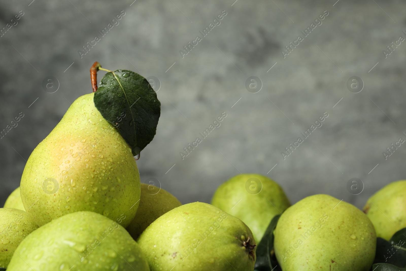 Photo of Many fresh ripe pears on table, closeup