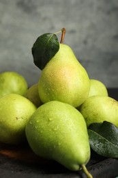 Photo of Many fresh ripe pears on table, closeup