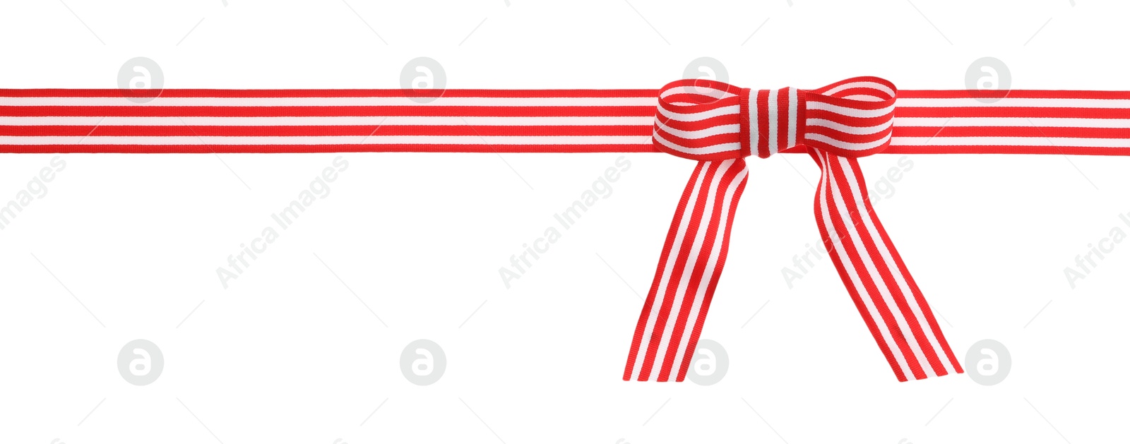 Photo of Colorful striped ribbon with bow isolated on white, top view