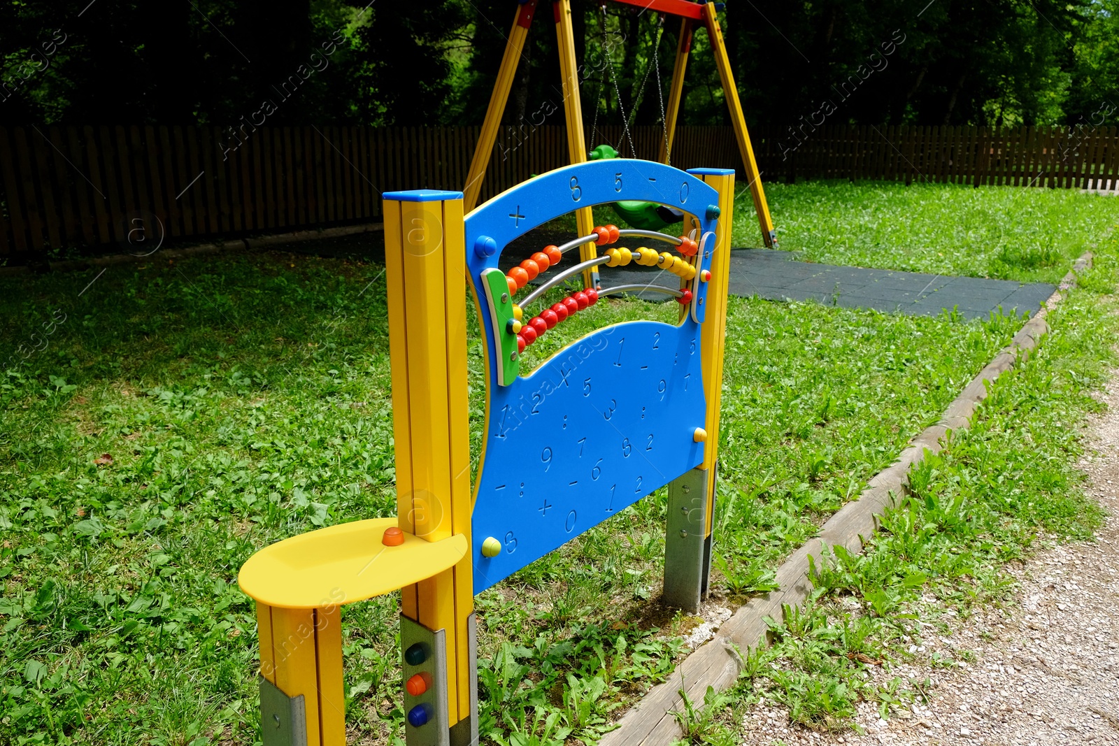 Photo of Playground equipment with abacus in park at summer