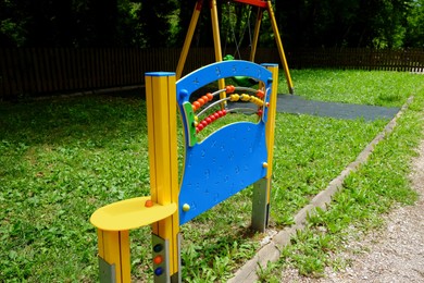 Photo of Playground equipment with abacus in park at summer