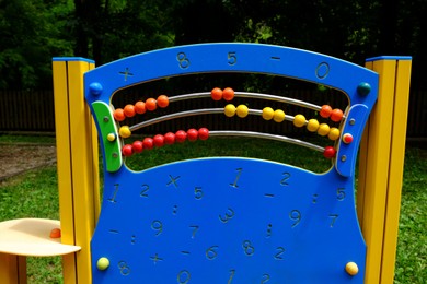 Photo of Playground equipment with abacus in park at summer