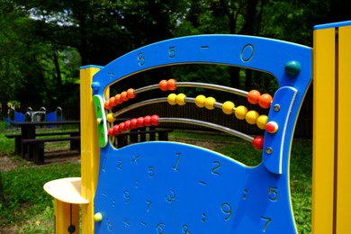 Photo of Playground equipment with abacus in park at summer