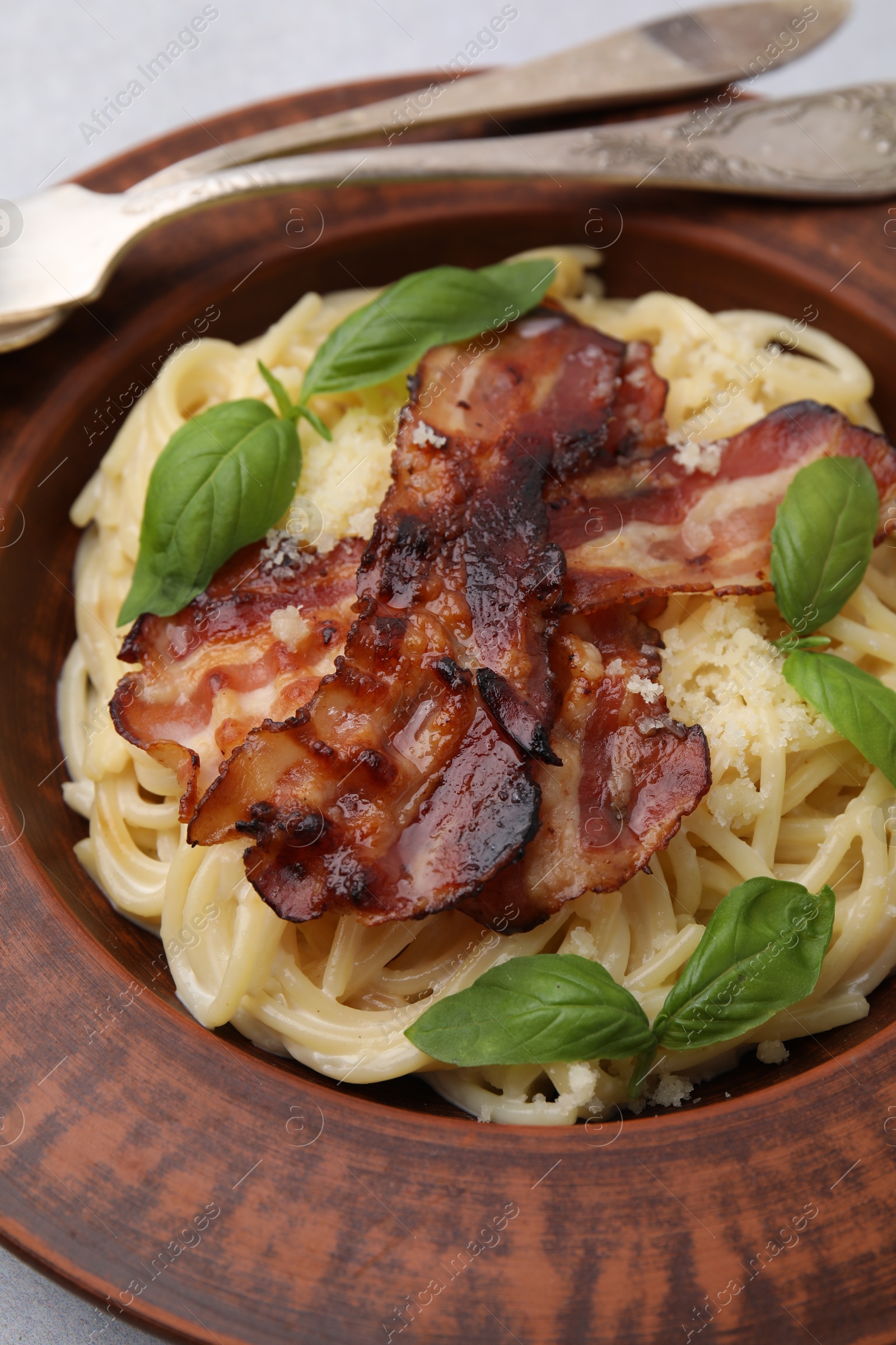 Photo of Delicious pasta Carbonara served on table, closeup